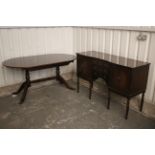 A regency-style inlaid-mahogany inverted breakfront sideboard, fitted three long drawers to centre