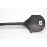 An African carved wood long-handled ladle with shaped bowl; 30" long.