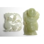 Two carved jade pendants.