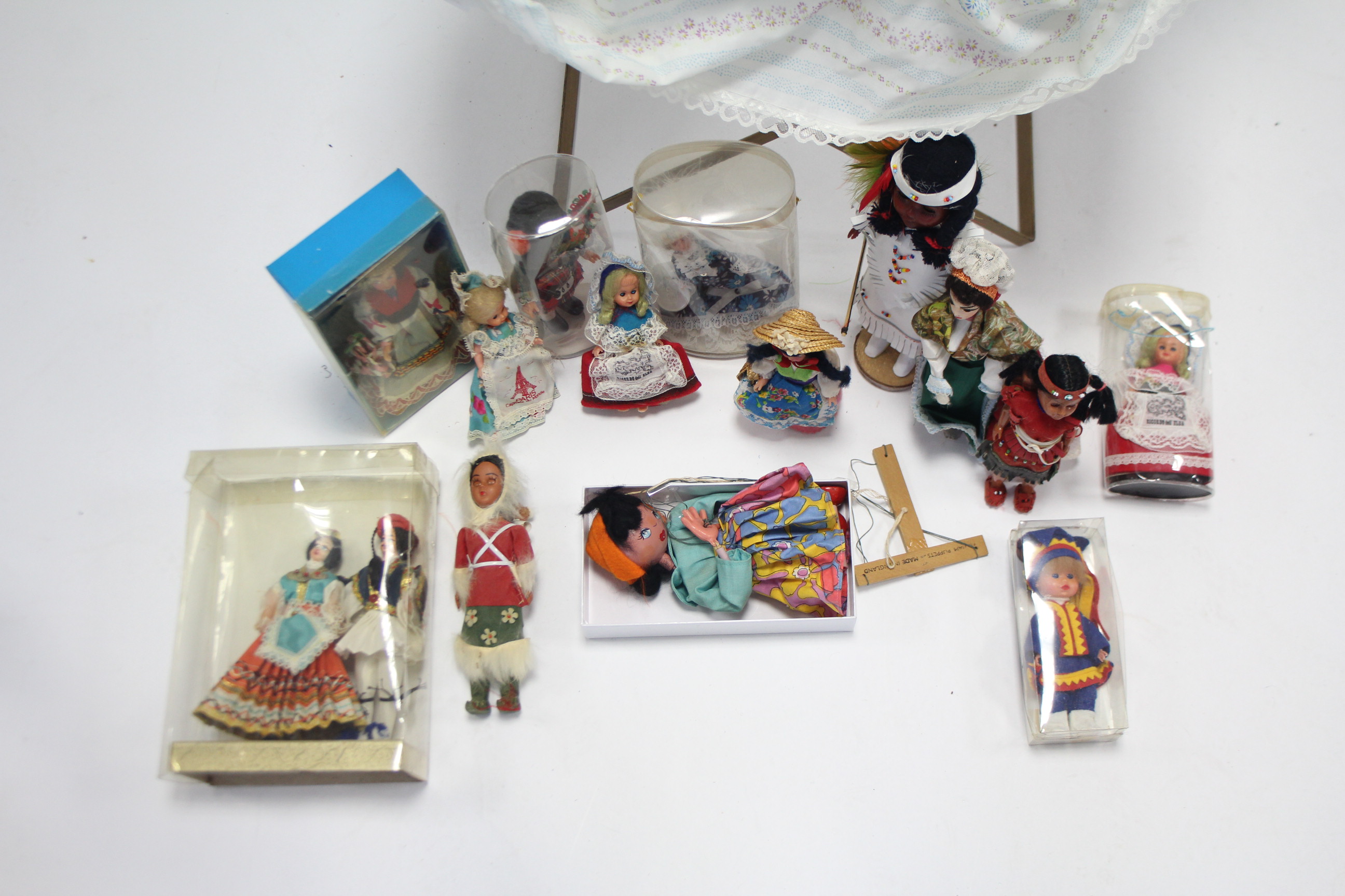 A Pedigree girl doll; a folding doll’s cot; thirteen various costume dolls; & a Pelham string - Image 2 of 2