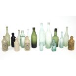 Four various stoneware bottles; & thirteen various glass bottles.