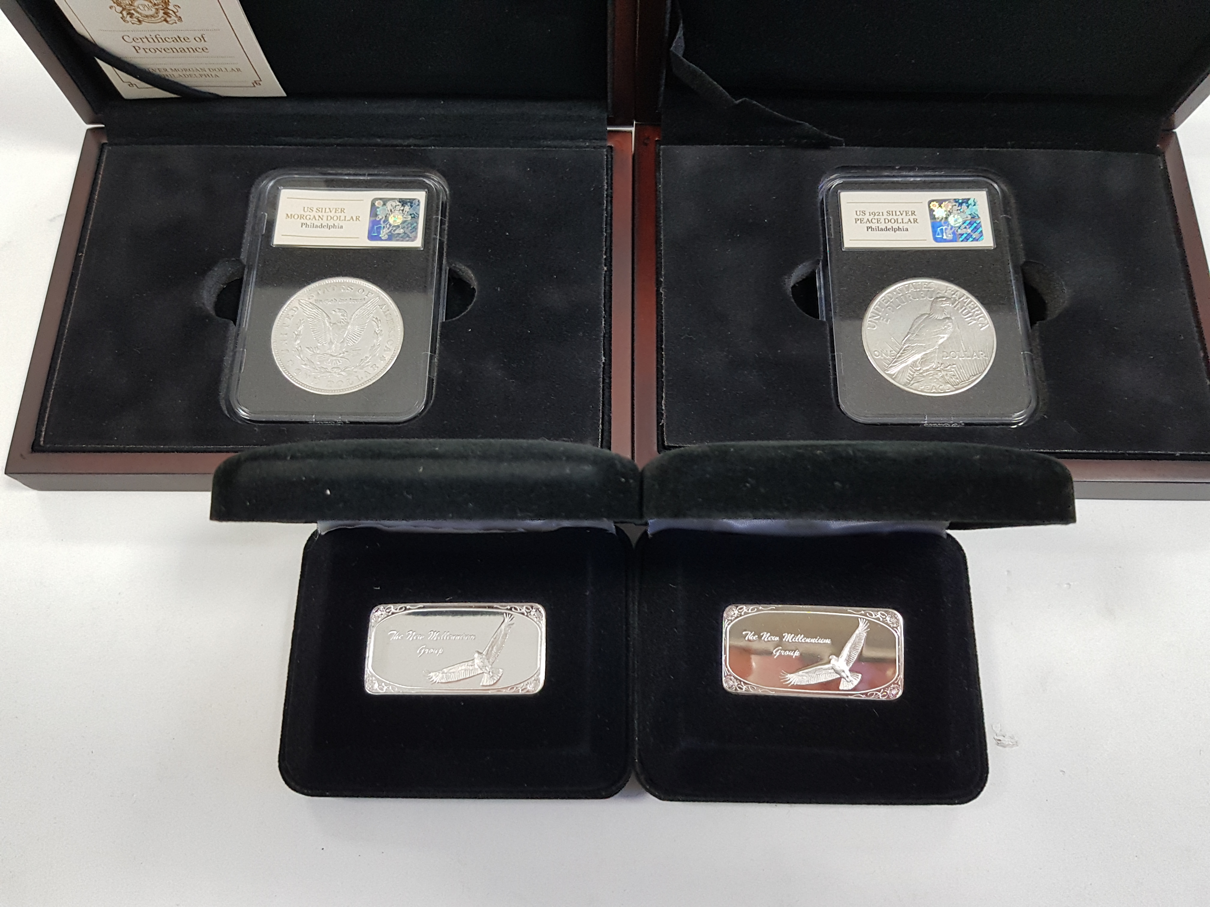 Two Franklin Mint fine silver “New Millennium Group” official ingots, each 31.1gms; & two USA silver