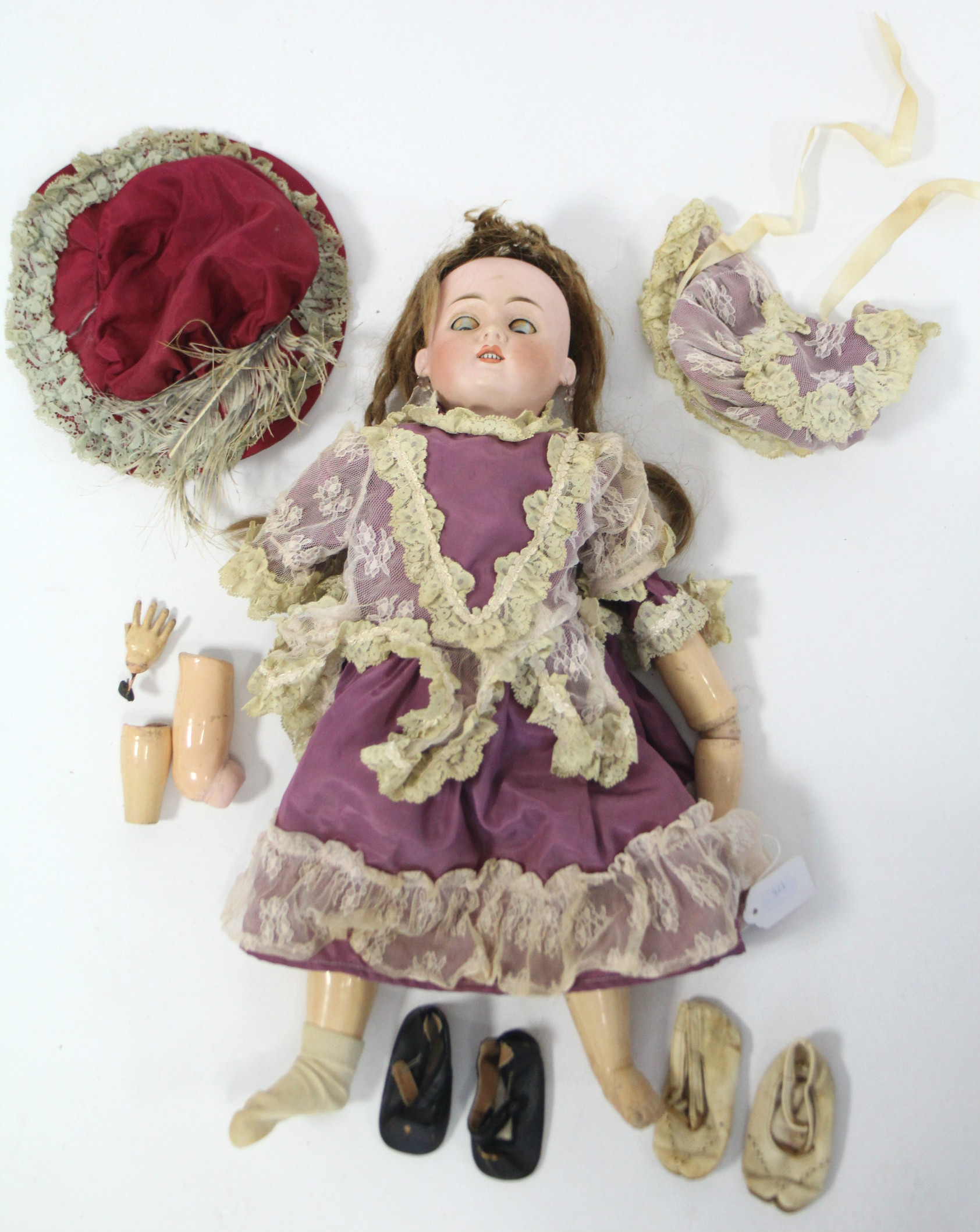 A bisque head girl doll (476 8 W), with blue sleeping eyes, open mouth, & with composition body,