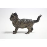 A cold-painted bronze standing model of a kitten with tail raised; 6¾” long x 4” high.