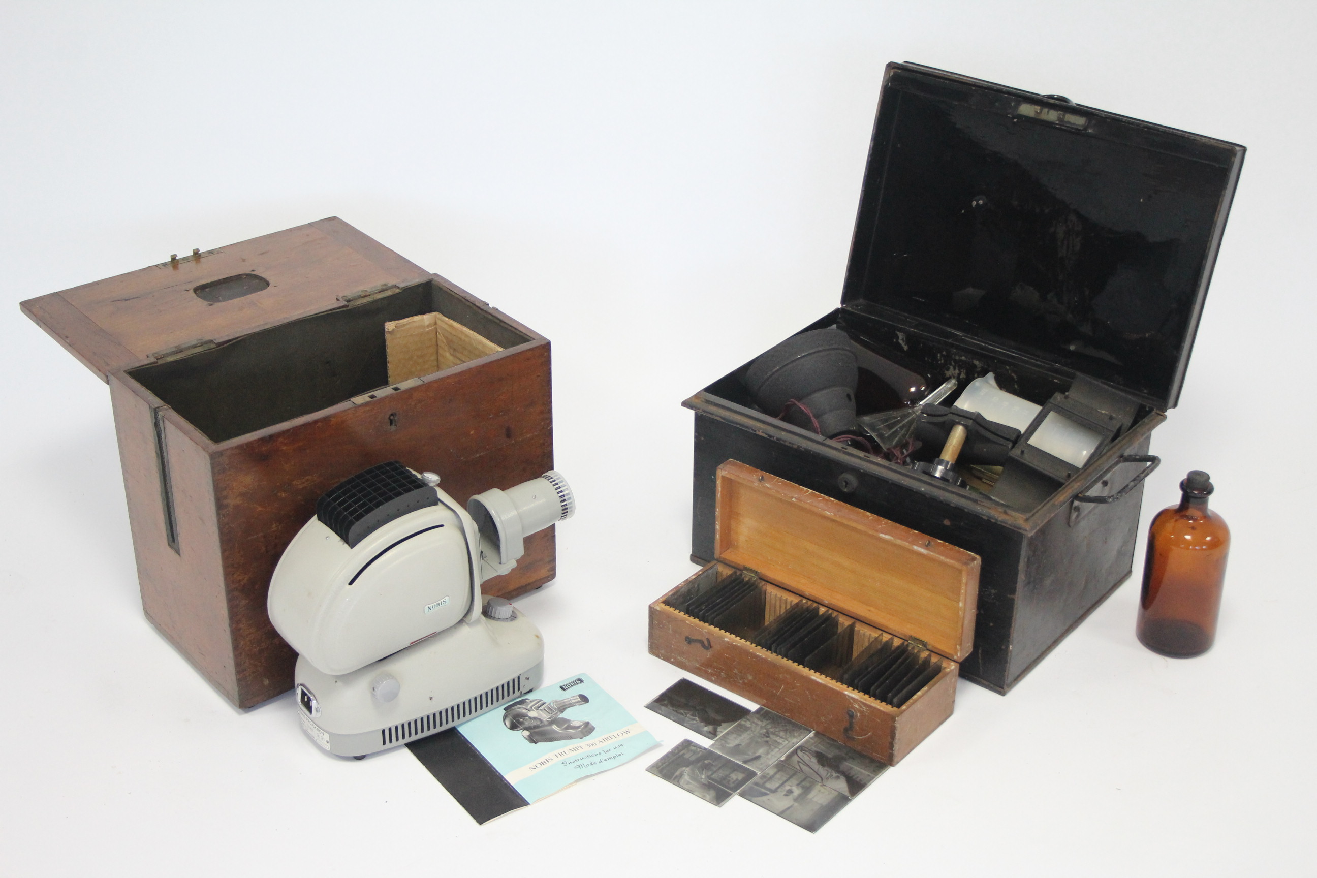 A Noris “Trumpf 300 Airflow” film projector, cased; thirty various glass negative plates; &