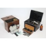 A Noris “Trumpf 300 Airflow” film projector, cased; thirty various glass negative plates; &