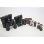 A pair of Greenkat 7 x 50mm field glasses; a pair of Omiya 8 x 30mm field glasses, both cased;