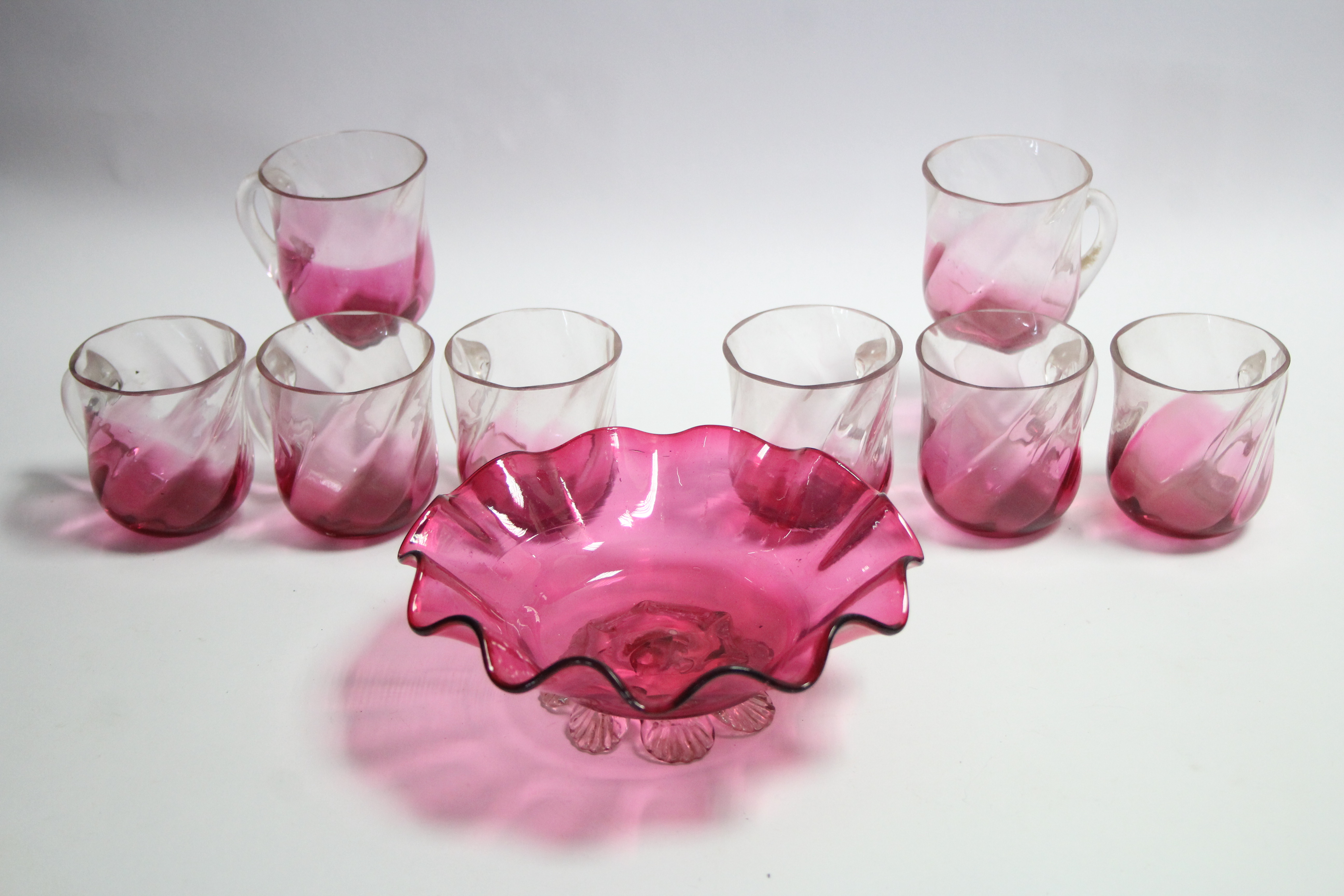 A Victorian cranberry glass sugar bowl with flared rim, 6¼” diameter; & a set of eight Victorian
