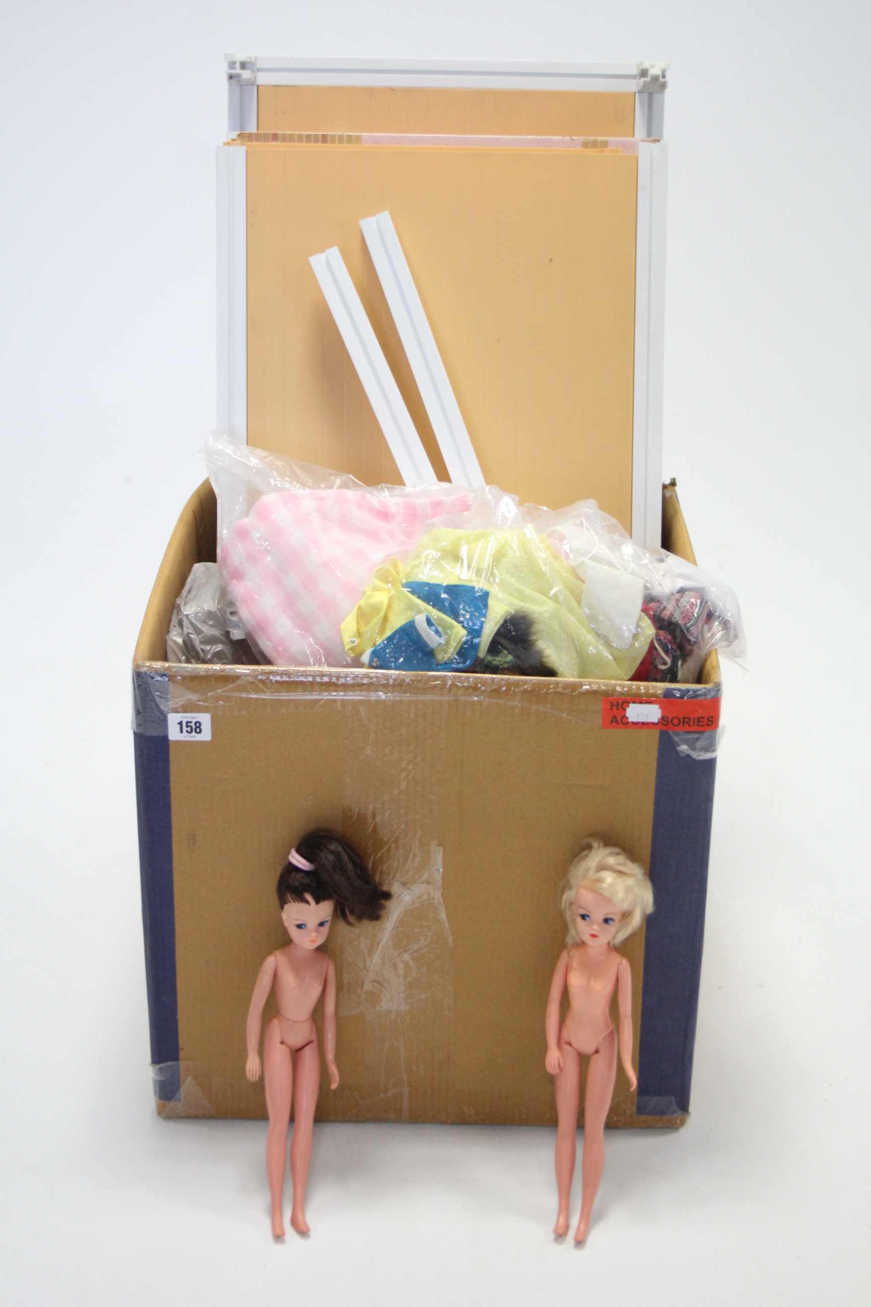 Two 1970’s Sindy dolls; a ditto Sindy doll’s house; & various other ditto accessories.