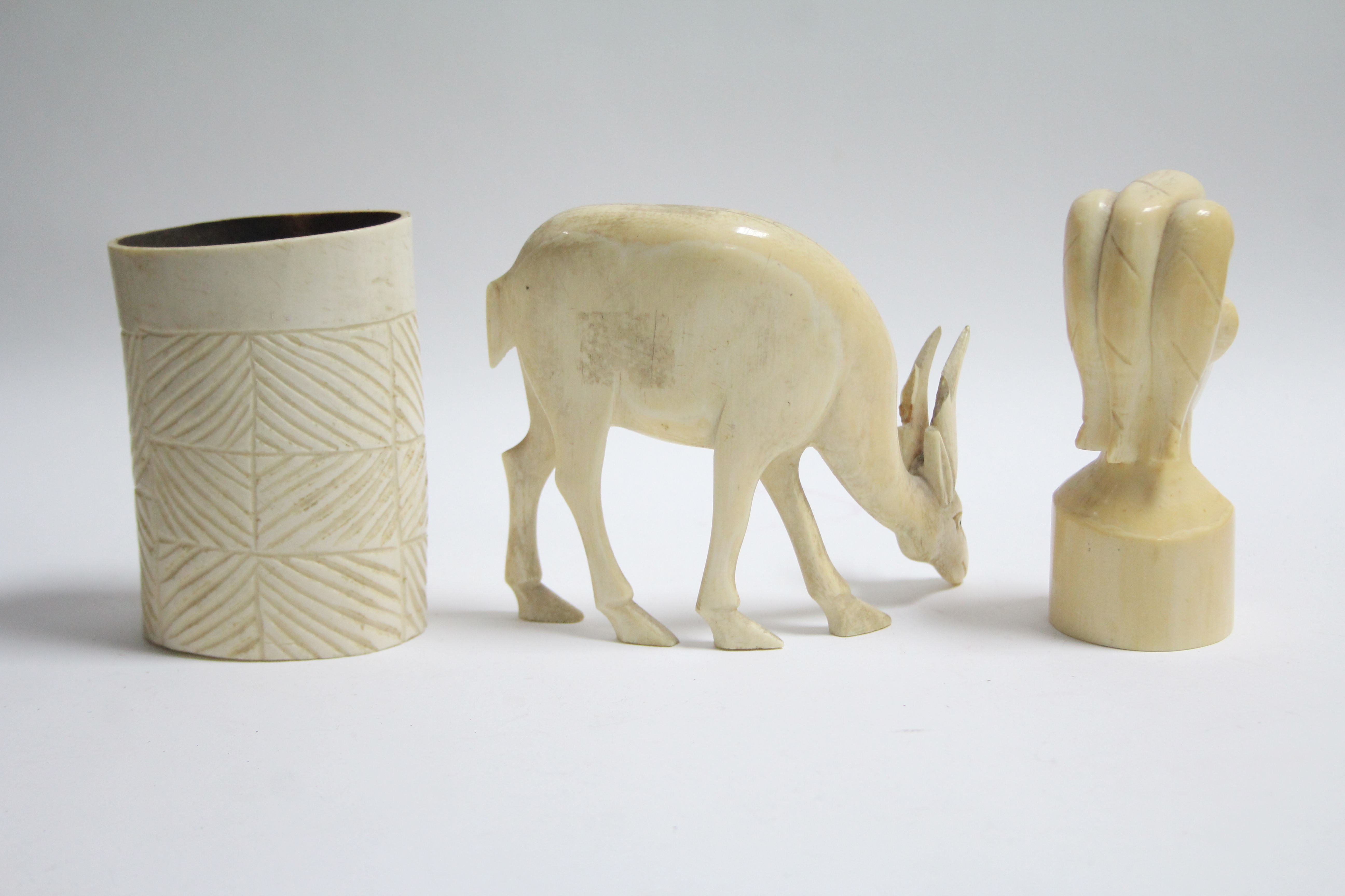 A carved ivory bust, 4½” high; a ditto antelope model, 4½” high; & an ivory spill vase, 4” high. - Image 2 of 3