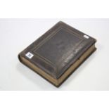 A Victorian leather-bound family photograph album containing forty-six black & white carte-de-visite