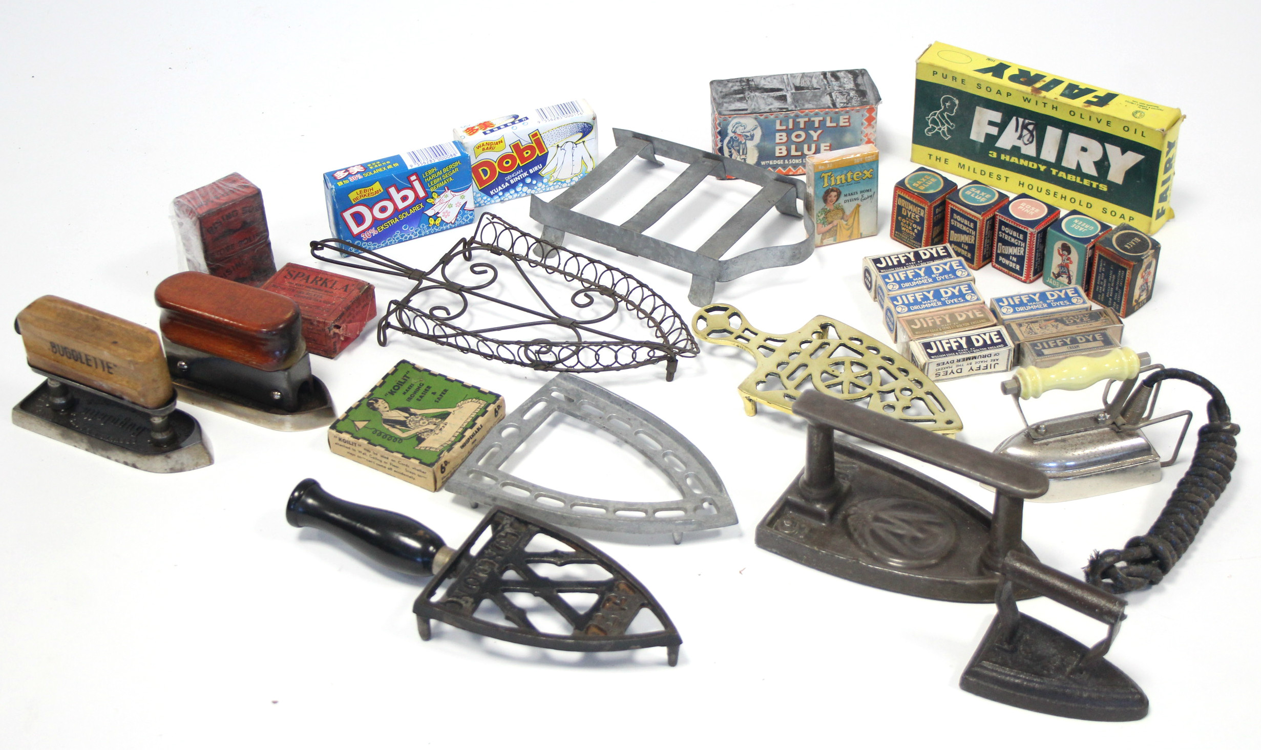 Five various smoothing irons; five iron trivets; & various advertising packets.