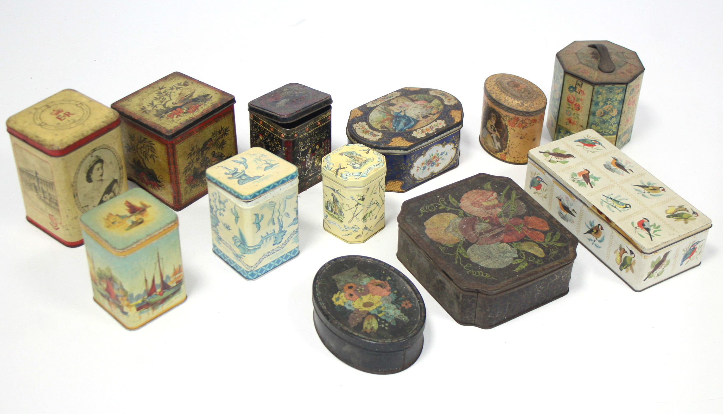 Twelve various advertising tins.