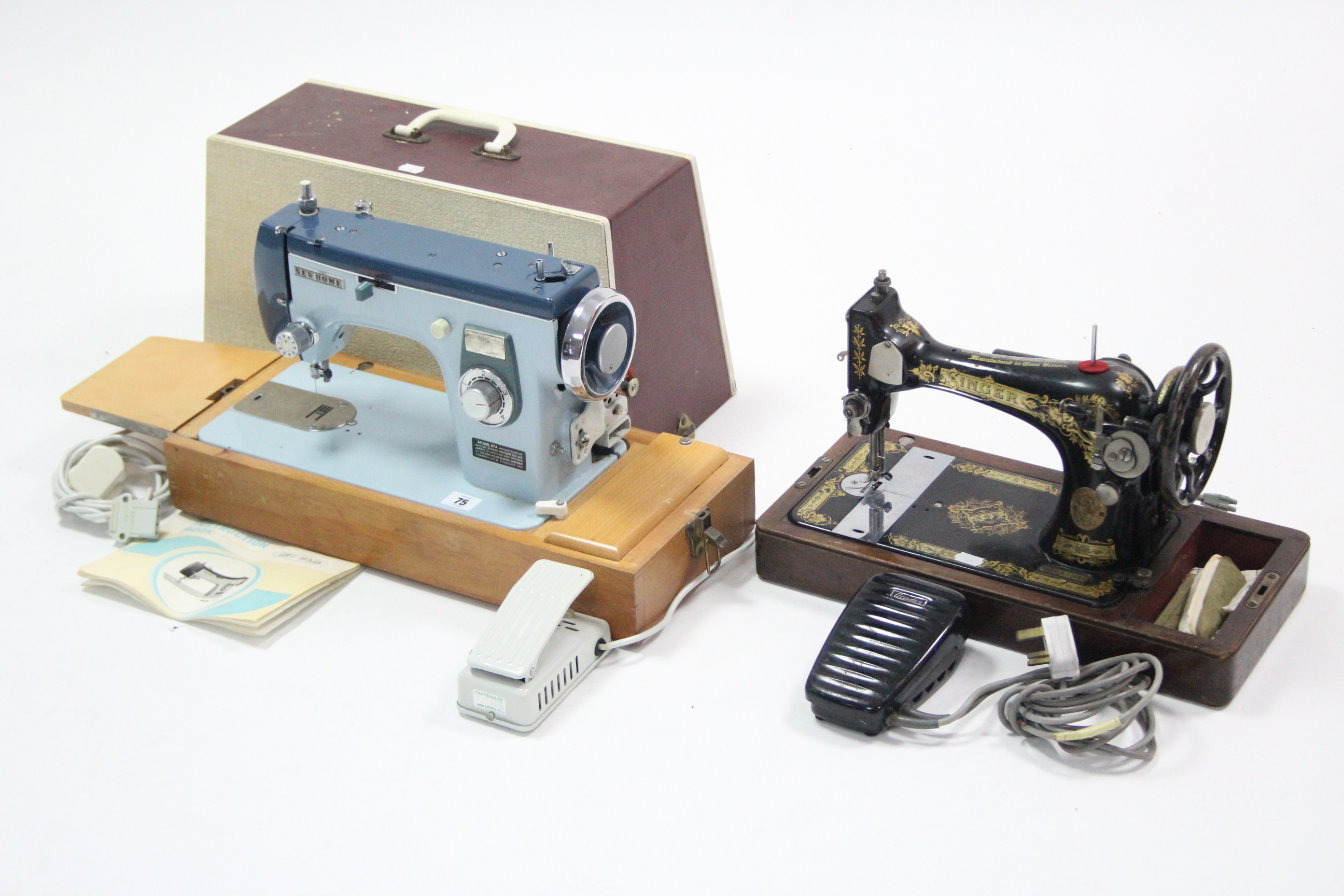 A new home electric sewing machine, w.o. with case; & a Singer hand sewing machine, lacking case.