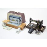 A new home electric sewing machine, w.o. with case; & a Singer hand sewing machine, lacking case.