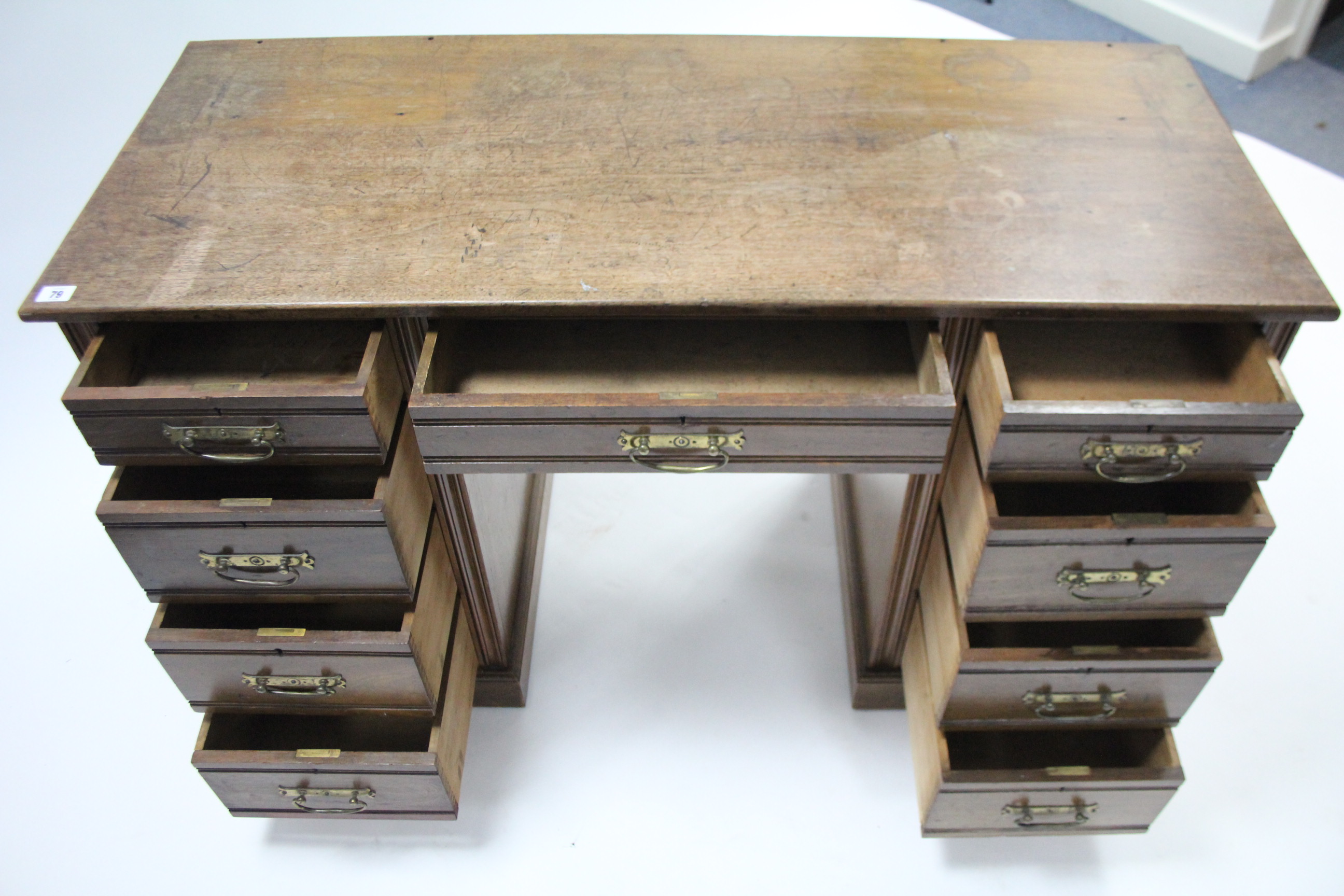 A late Victorian walnut knee-hole desk fitted with an arrangement of nine drawers, & on plinth base, - Image 3 of 3
