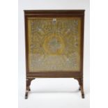 A 19th century brass inlaid mahogany frame firescreen, inset silver thread embroidered foliate &