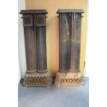 A pair of early/mid-20th century cast-iron heaters each with twin centre column & on rectangular