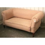 A Victorian Chesterfield-style two seater drop-end settee upholstered pink & cream geometric