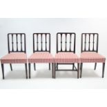 A set of four 19th century mahogany rail-back dining chairs with padded seats, & on square tapered