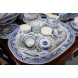 A Staffordshire pottery blue & white “Willow” pattern vegetable tureen; a similar meat plate; &