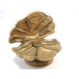 A gold-finish composition child’s seat in the form of an oyster shell, 34” wide.