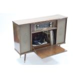 A mid-20th century Regentone radiogram (Model No. SRG 23) in laminate case, 40¼” wide.