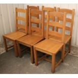 A set of six ladder-back dining chairs with hard seats, & on square legs with plain stretchers.