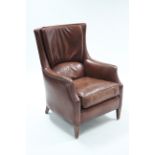 A Bendic (Dutch) brass-studded brown leatherette armchair on short, square tapered legs.