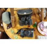 A pair of Greenkat 8 x 30mm field glasses; a Panasonic zoom camera, each with case; & various