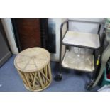 A cane nest of three circular occasional tables; together with a bed tray; a two-tier trolley;