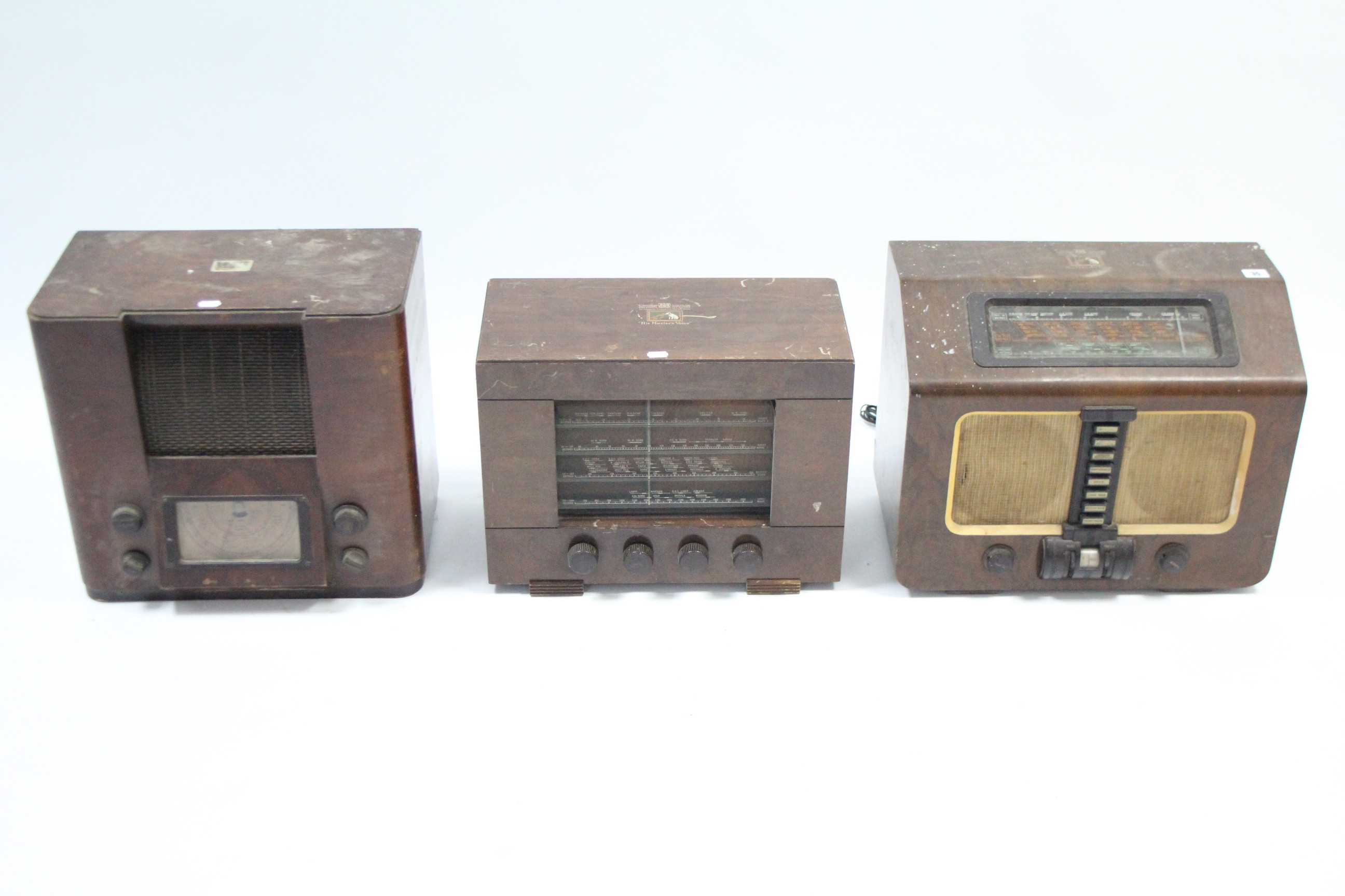 Three vintage HMV valve radios each in wooden case.