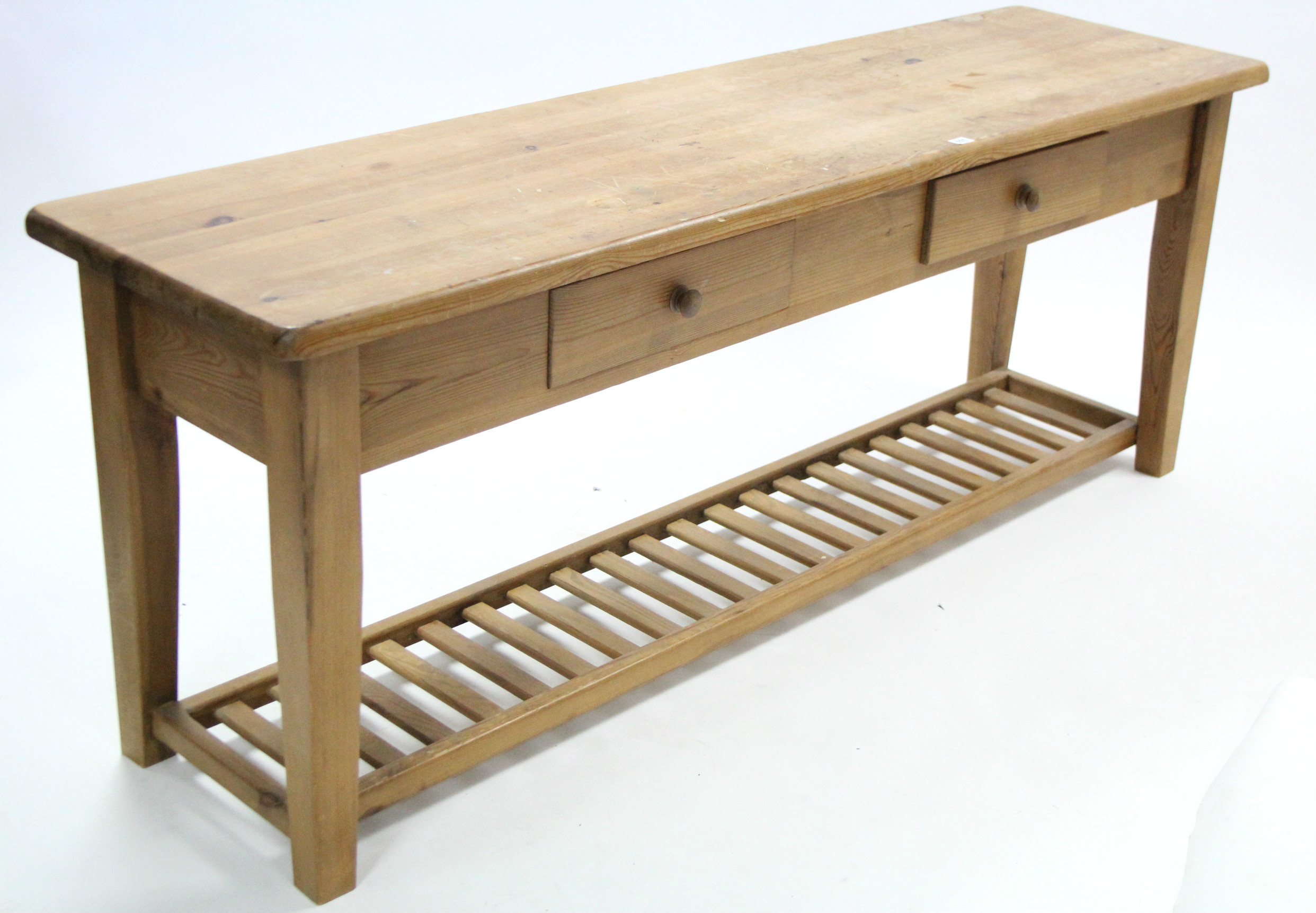 A pine low side table with rectangular top, fitted two frieze drawers & on square tapered legs