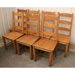 A set of seven ladder-back dining chairs with hard seats, & on square legs with plain stretchers.