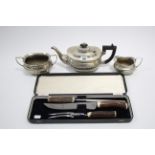 An EPNS three piece tea service of oblong semi-fluted design; & a set of three stainless steel
