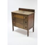 A mid-20th century oak small chest fitted three long graduated drawers, 30” wide.