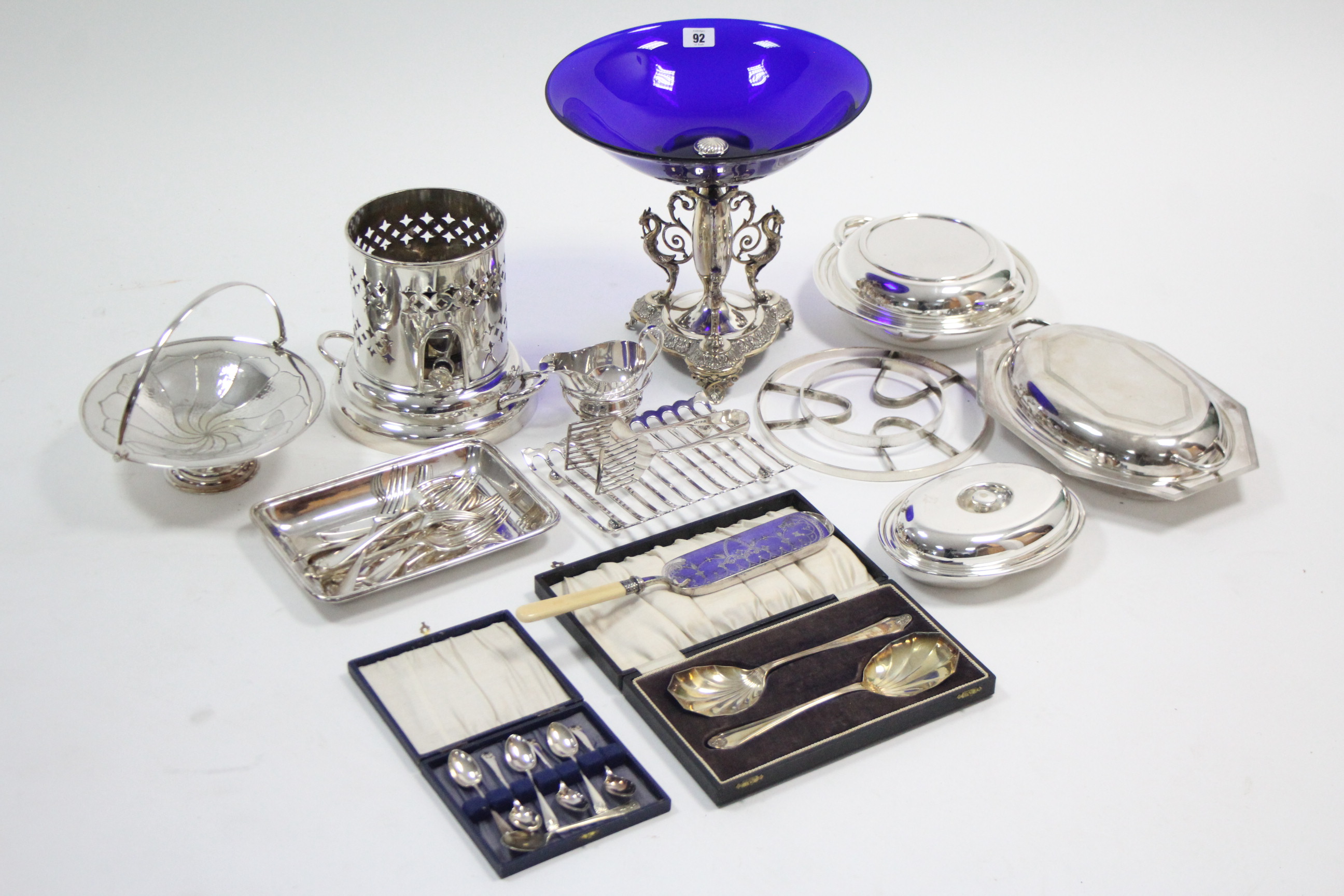 A Sheffield silver plated comport on triform base & fitted with blue glass bowl, 12” diam.; a silver