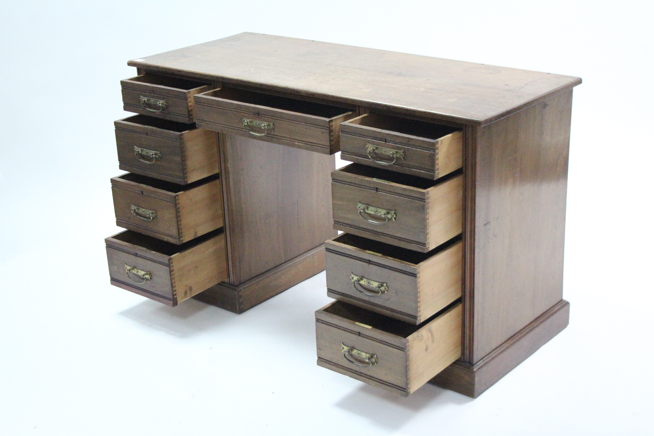 A late Victorian walnut knee-hole desk fitted with an arrangement of nine drawers, & on plinth base, - Image 2 of 3