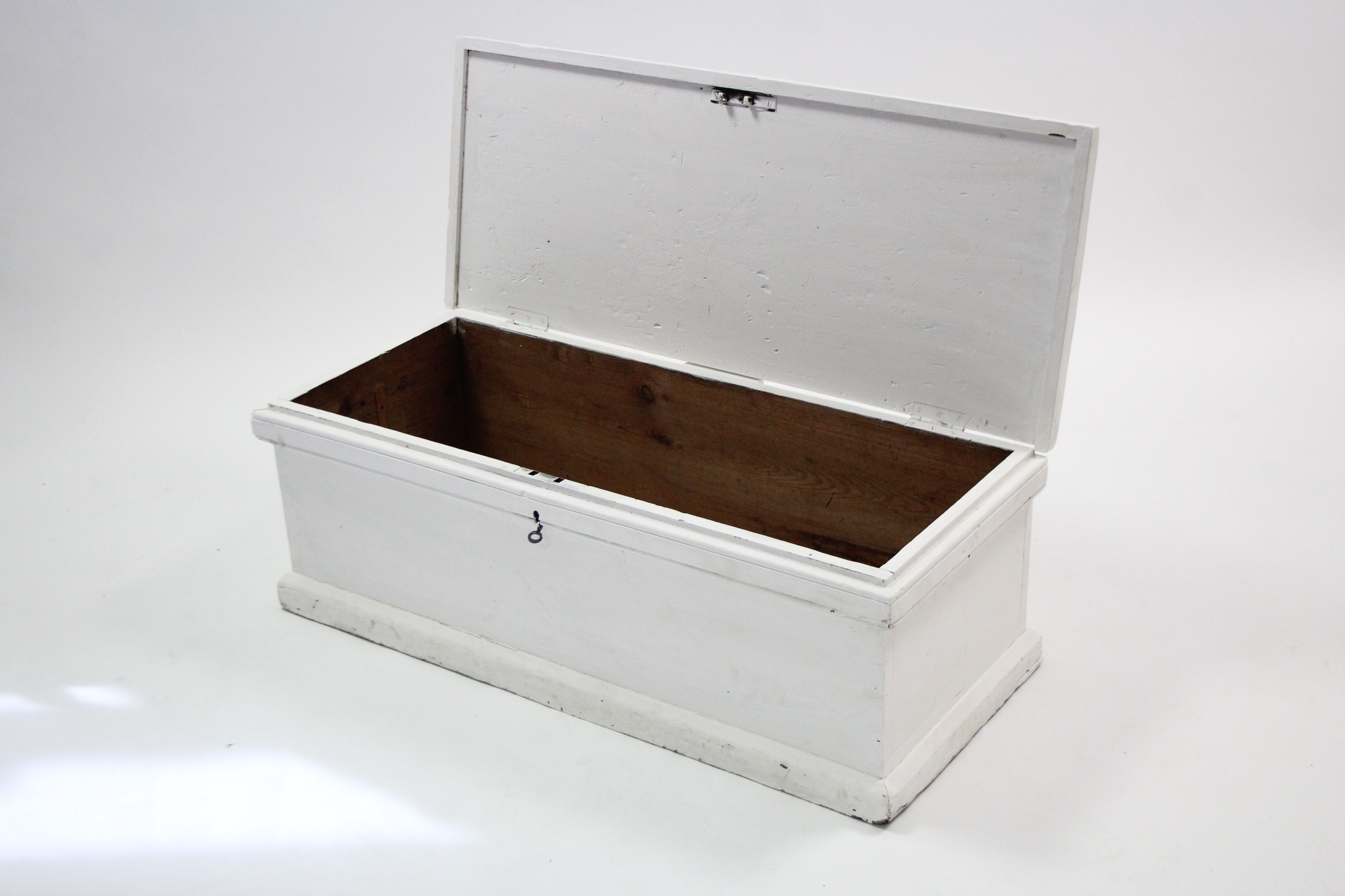 A Victorian white painted pine blanket box with hinged lift-lid, & on plinth base, 39” wide.