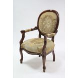 A continental-style elbow chair with sprung seat & padded back, & on cabriole legs.
