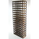 A ninety-six division tall standing wine rack, 24” wide x 63” high.