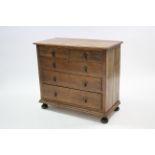 An early 20th century small oak chest, fitted two short & three long graduated drawers with brass