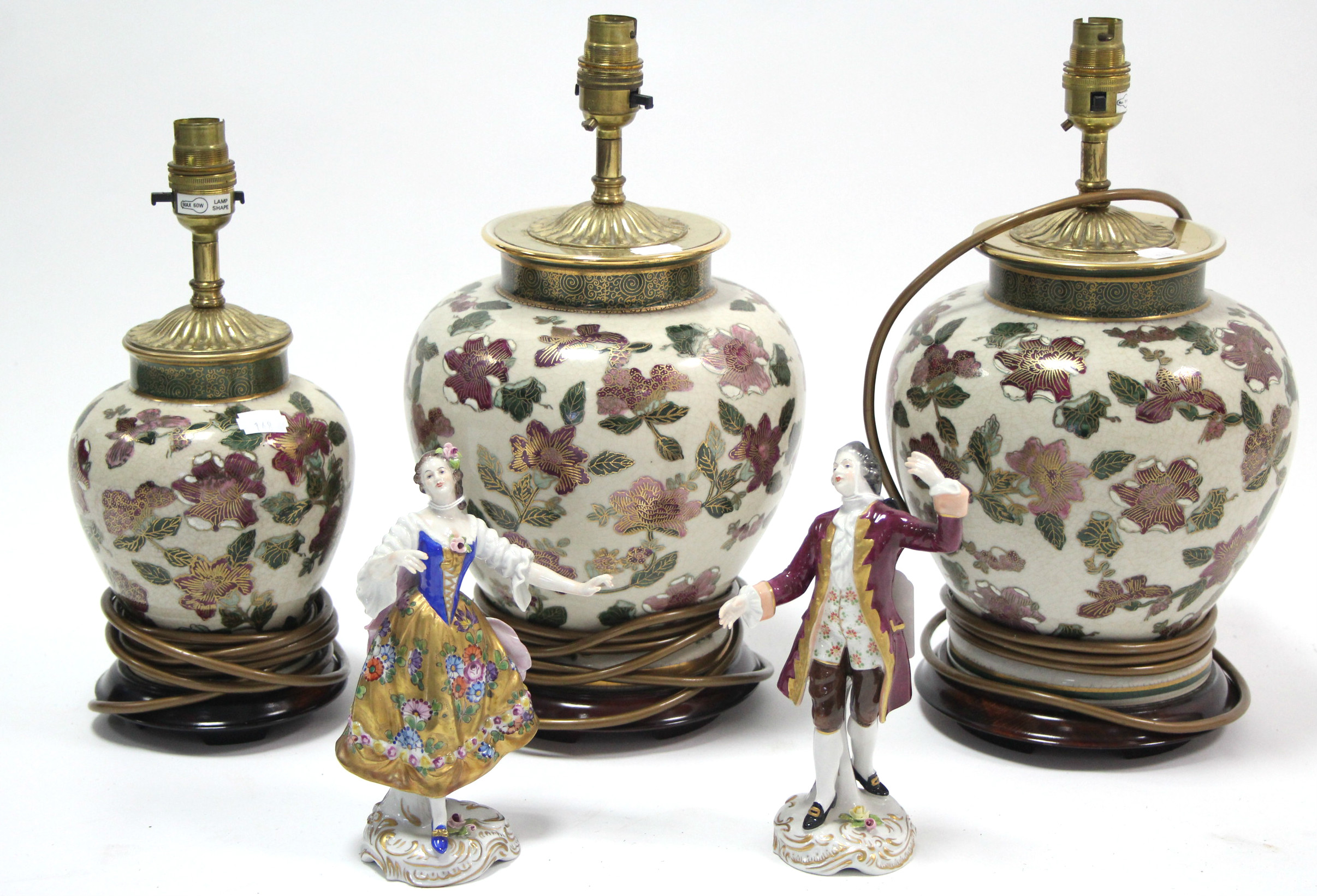 A pair of Dresden porcelain male & female costume figures; together with three ceramic table