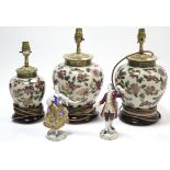 A pair of Dresden porcelain male & female costume figures; together with three ceramic table