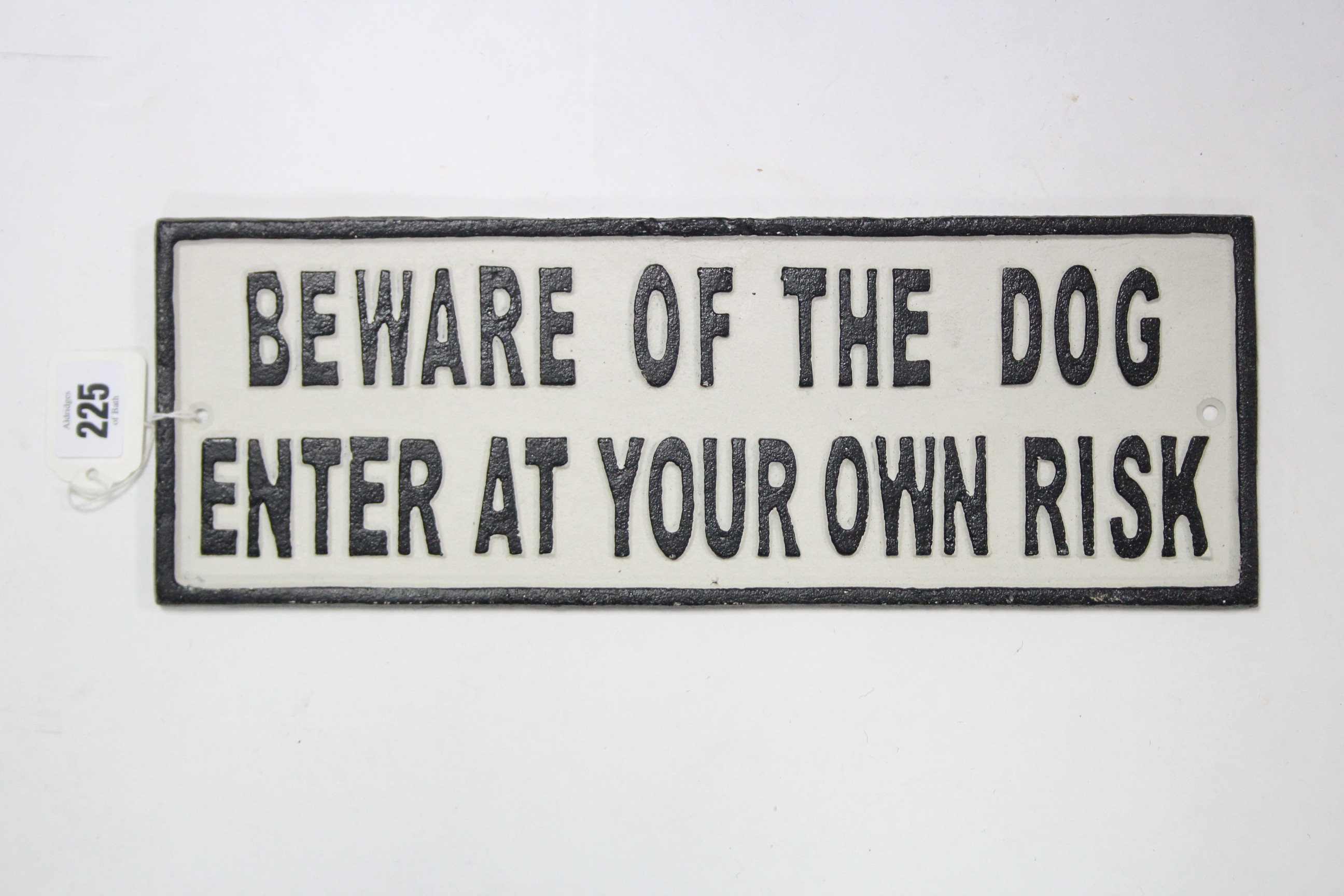 A reproduction painted cast-iron rectangular sign “BEWARE OF THE DOG ENTER AT YOUR OWN RISK”, 5” x