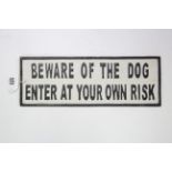 A reproduction painted cast-iron rectangular sign “BEWARE OF THE DOG ENTER AT YOUR OWN RISK”, 5” x