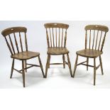 Three Windsor-style spindle-back kitchen chairs with hard seats, & on turned legs with spindle