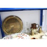 An eastern brass engraved circular tray, 16” diameter; a ditto pair of candlesticks; a ditto pair of