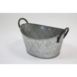 A modern aluminium oval two-handled planter 16” wide, as new.