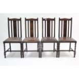 A set of four 1930’s oak rail-back dining chairs with padded drop-in seats, & on barley-twist legs